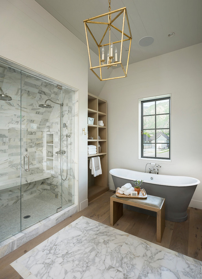 Bathroom marble shower with marble tile rug and hardwood floors. Paint color is Farrow & Ball Shaded White half strength. #Bathroom Jackson and LeRoy