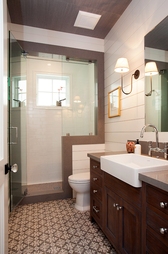 Bathroom. Bathroom Ideas. This bathroom brings the style with its gorgeous mix of materials. Contemporary meets traditional with the combination of white shiplap walls, caesarstone pebble quartz counter top and shower jamb, and hand crafted vanity with custom stain applied. #Bathroom #shiplap #flooring #tiles Patterson Custom Homes