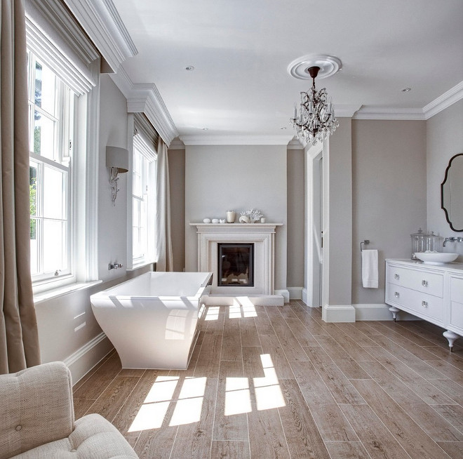 Bathrooms. French Bathrooms. Bathrooms This bathroom comes complete with fireplace, a free standing bath and wood-like floor tiles. #FrenchBathrooms #bathrooms Hayburn & Co. 