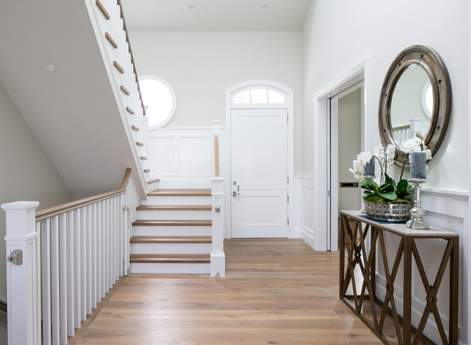 Foyer Flooring. Foyer waincoting and floors. The custom flooring is white oak 8” plank. Traditional wall wainscoting - foyer #foyer #flooring #wainscoting #customflooring #whiteoak #plank #traditionalwainscoting Brandon Architects, Inc. Churchill Design.