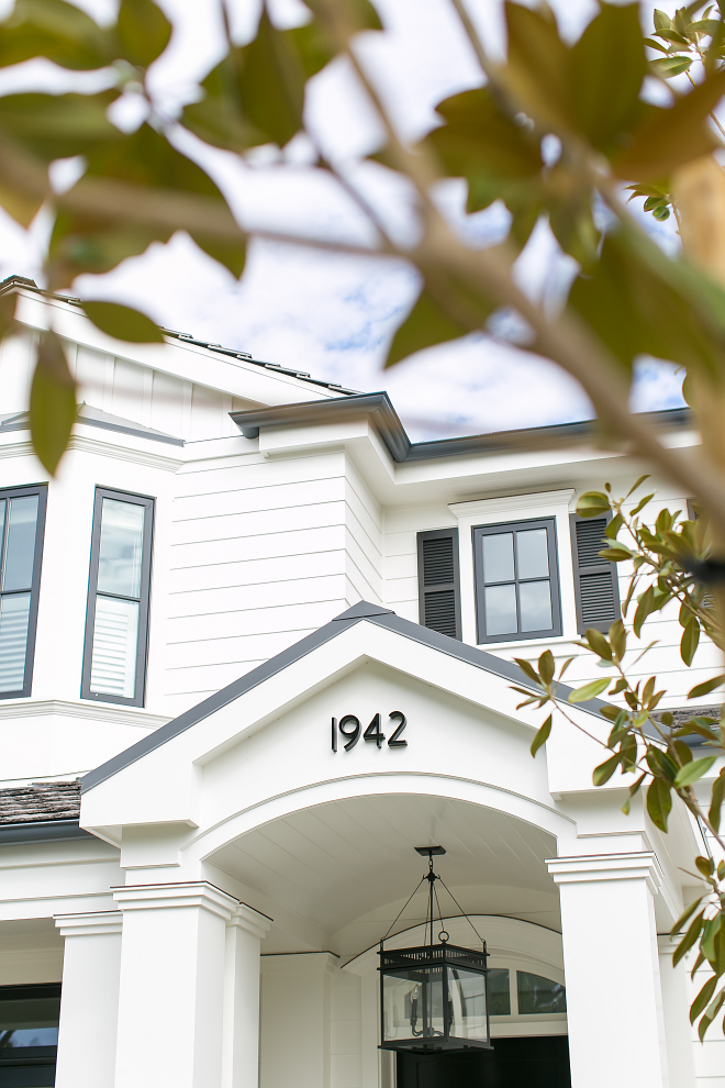 House Number. The house numbers match the outdoor lighting and contrasts with the white exterior. House Number #HouseNumber Brandon Architects, Inc. Churchill Design. Legacy CDM Inc.