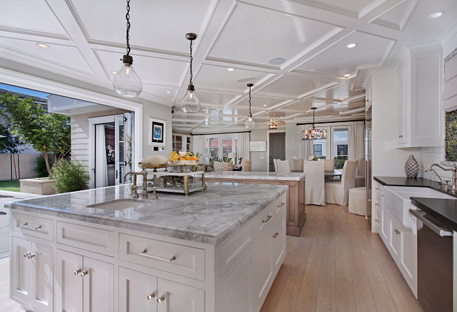 Island Countertop ideas. Natural Quartz Carrara. Island countertop material and edge details. The countertops are Natural Quartz Carrara, super white polished slab with ogee edge detail and 2 1/4" apron. #Kitchen #island #marble #edge #countertops #NaturalQuartzCarrara #superwhite #polishedslab #ogeeedge Patterson Custom Homes