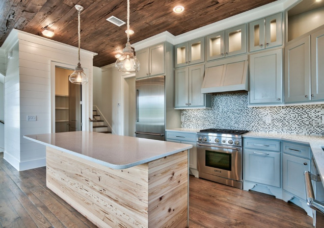 Kitchen with reclaimed Cyrpress wood on ceiling and reclaimed plank on island. Chi-Mar Construction