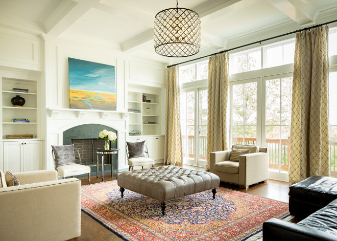 Living room with coffered ceiling and built-in cabinets. Art above fireplace is by Victoria Jackson Art. #Livingroom #cofferedceiling #cabinets #art T-Olive Properties