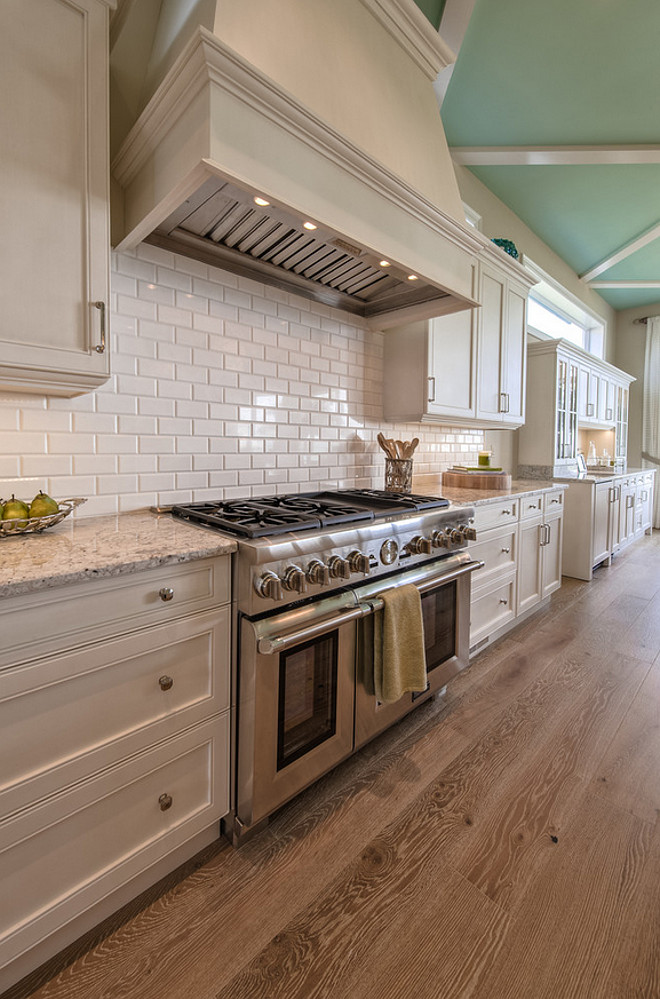 Off white kitchen cabinet with wire brushed white oak flooring and Robin Egg Blue ceiling paint color. #offwhite #kitchen #wirebrushedfloor #whiteoak #flooring #RobinEggBlue