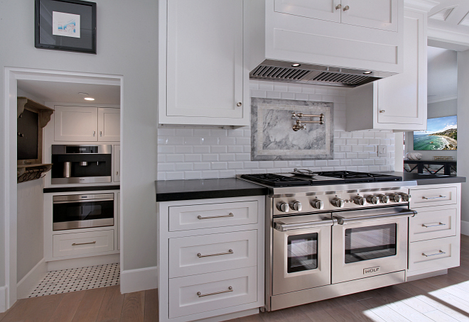 Kitchen. Kitchen The cabinets were custom fabricated by California Wood Designs and the hardware came from Restoration Hardware. Backsplash is Glossy white 3x6 subway tile with bevel backsplash set running bond with slab insert at range. Pot Filler- Rohl A1451XMPN-2 #kitchen #kitchens #kitchen Patterson Custom Homes