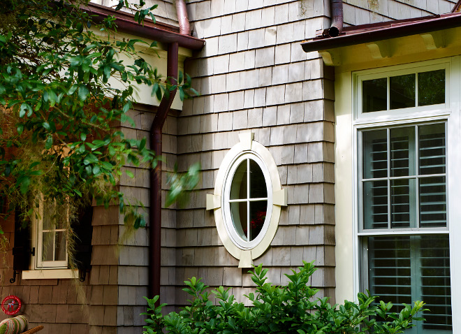 Shingle home with oval window. T.S. Adams Studio