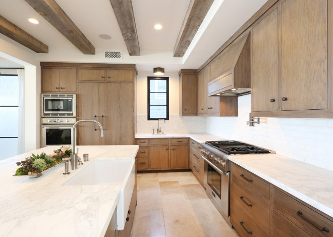 White oak kitchen cabinets White oak kitchen cabinets and marble countertop to contrast with the wood cabinets. #Whiteoak #kitchencabinets . Blackband Design. Graystone Custom Builders