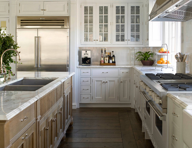 Traditional white kitchen. Traditional white kitchen with calacatta gold marble counters. Traditional white kitchen with calacatta gold marble counters designed by Phoebe Howard. #Traditionalwhitekitchen #Traditionalkitchen #whitekitchen #calacattagoldmarble #marblecounters #kitchen Phoebe Howard. Eric Piasecki Photography.
