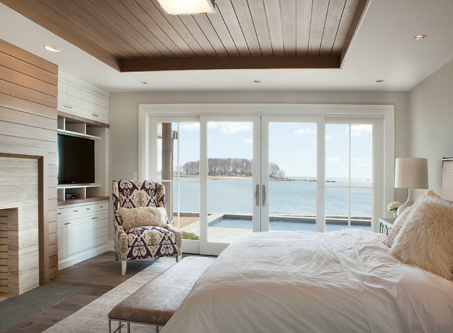 Bedroom shiplap tray ceiling. Bedroom features shiplap tray ceiling and fireplace with shiplap paneling as well. #Bedroom #shiplap #Shiplapceiling #trayceiling #shiplapfireplace Michael Greenberg & Associates.