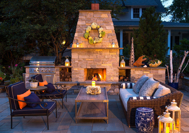 Patio. Perfect patio for outdoor entertaining at any time of the day or night. ceramic garden stool firewood storage lanterns outdoor fireplace outdoor furniture stone chimney wicker sofa #patio #outdoors 