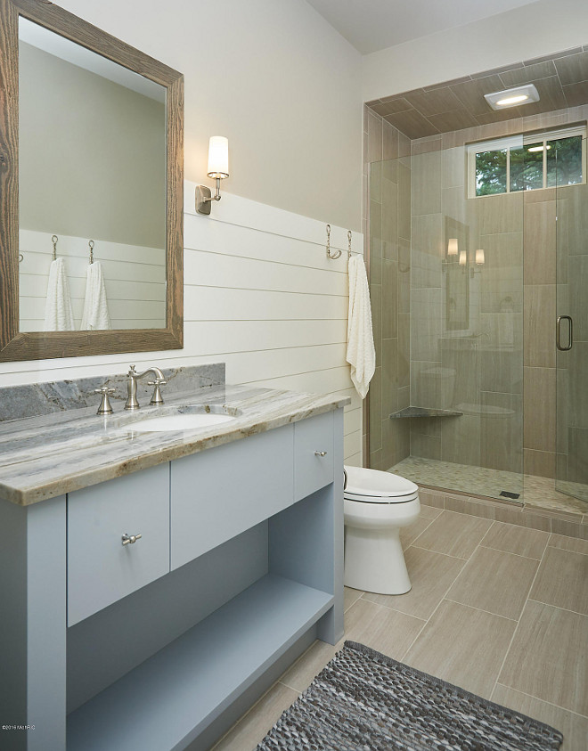 Bathroom Shiplap Wainscoting. Bathroom features wall shiplap wainscoting and neutral floor and shower tiles. #Bathroom #Shiplap #Wainscoting #Bathroomwainscoting #bathroomshiplap #bathroomwall