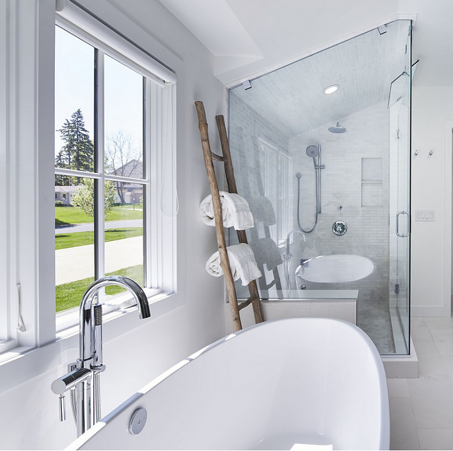 Bathroom ladder. Bathroom towels placed on ladder. A wooden ladder brings texture to this white bathroom. #bathrom #ladder #towels Martha O'Hara Interiors