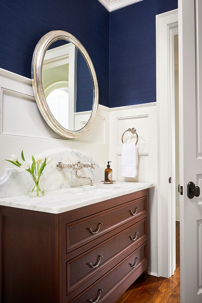 Bathroom wainscoting walls with wallpaper above. L. Kae Interiors