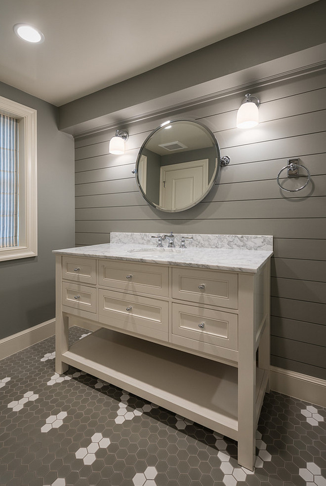 Bathroom with shiplap accent wall painted in dark gray paint color. Basement Bathroom with shiplap accent wall painted in dark gray paint color #Bathroom #shiplapaccentwall Northstar Builders, Inc.