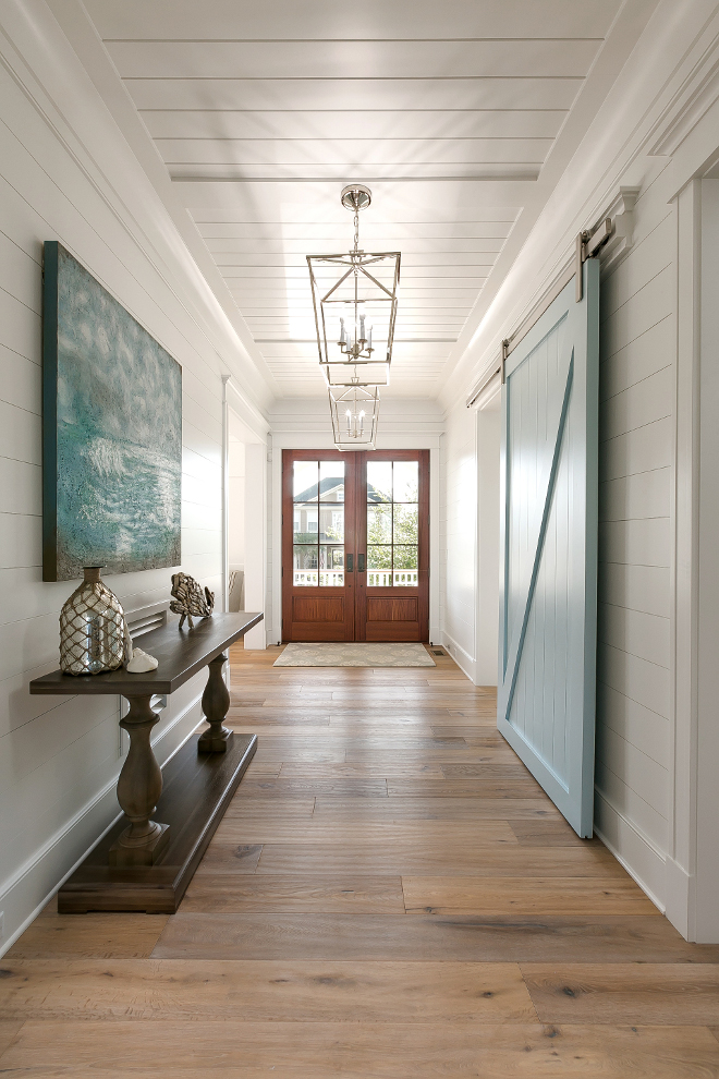 Benjamin Moore Yarmouth Blue. Shiplap foyer walls and blue barn door painted in Benjamin Moore Yarmouth Blue. This gorgeous foyer feature shiplap walls, tongue and groove paneling ceiling and blue barn door painted in Benjamin Moore Yarmouth Blue. Blue barn door paint color is Benjamin Moore Yarmouth Blue #Foyer #shiplap #Bluebarndoor #barndoor #BenjaminMooreYarmouthBlue