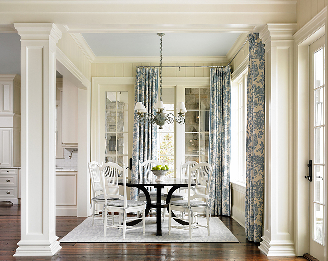 Breakfast room. In the breakfast room, the Pottery Barn chairs were repurposed from previous home. The designer painted them in Alabaster by Sherwin Williams in semi gloss to refresh them. Round breakfast table was from Holland and Company. Breakfast Room Drapery Fabric: Schumacher. #BreakfastRoom T.S. Adams Studio. Interiors by Mary McWilliams from Mary Mac & Co.