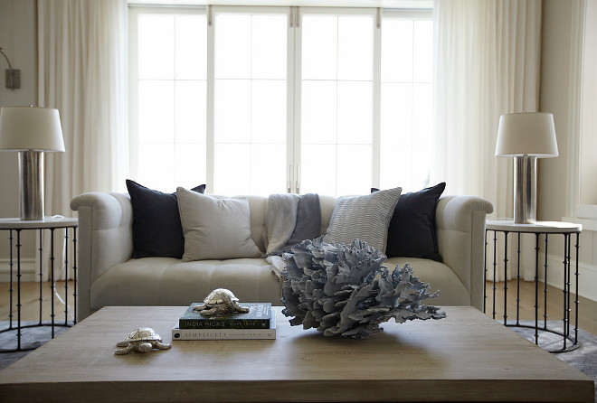 Coastal decor on coffee table. Elegant coastal decor on coffee table. #coastaldecor #coffeetable #homeideas #homedecor TS Adams Studio Architects. Laura Allyson Interiors.