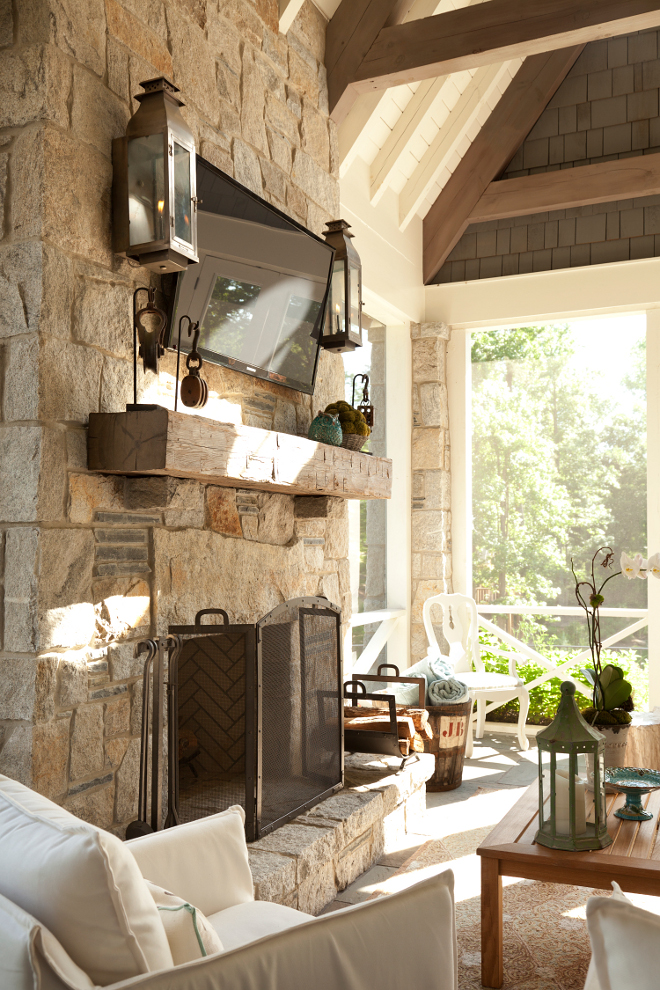 Outdoor fireplace. Outdoor stone fireplace. A stone fireplace is the focal point of this screened-in porch. #fireplace #stonefireplace T.S. Adams Studio. Interiors by Mary McWilliams from Mary Mac & Co. 