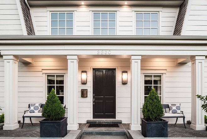 Front porch planters, columns, classic front door, slate herringbone porch tile, porch benches. #porch #frontporch #planters #porchtile #herringbonetile