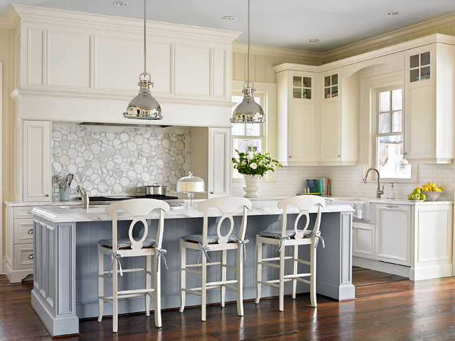 Kitchen. I love the open feel of this off-white kitchen. Kitchen countertop is Calcutta Danby. Kitchen cabinet paint color is a custom blend by Design Galleria. Counter stools were from the homeowner's previous home and the designer painted them in Alabaster by Sherwin Williams in semi gloss. Island pendants in the kitchen are from Circa Lighting. #kitchen Interiors by Mary McWilliams from Mary Mac & Co.