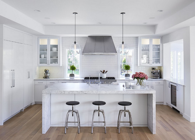 Kitchen waterfal marblel island. Kitchen with waterfall marble island. Waterfall Marble kitchen island countertop. #kitchen #kitchenisland #waterfallkitchenisland #waterfallmarbleisland Martha O'Hara Interiors