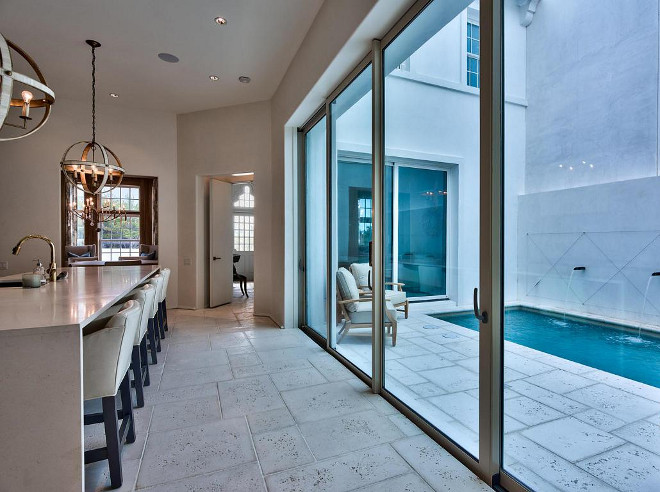 Durable kitchen flooring. The first-floor flooring is Rice White Peacock Pavers. #Flooring #kitchen #Durableflooring #firstfloorflooring # RiceWhitePeacockPavers Scenic Sotheby's Realty. Interiors by Jan Ware Designs.