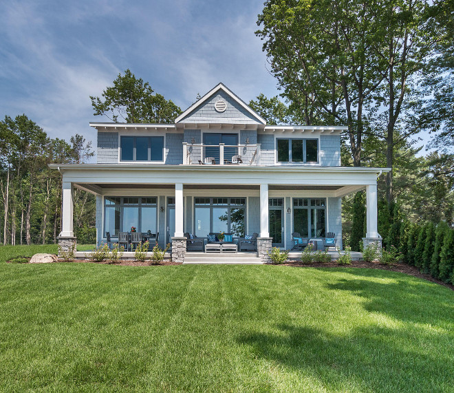 Lake cottage exterior with blue shingles and stone columns. Stone used on columns are Colonial Gray River Rock.