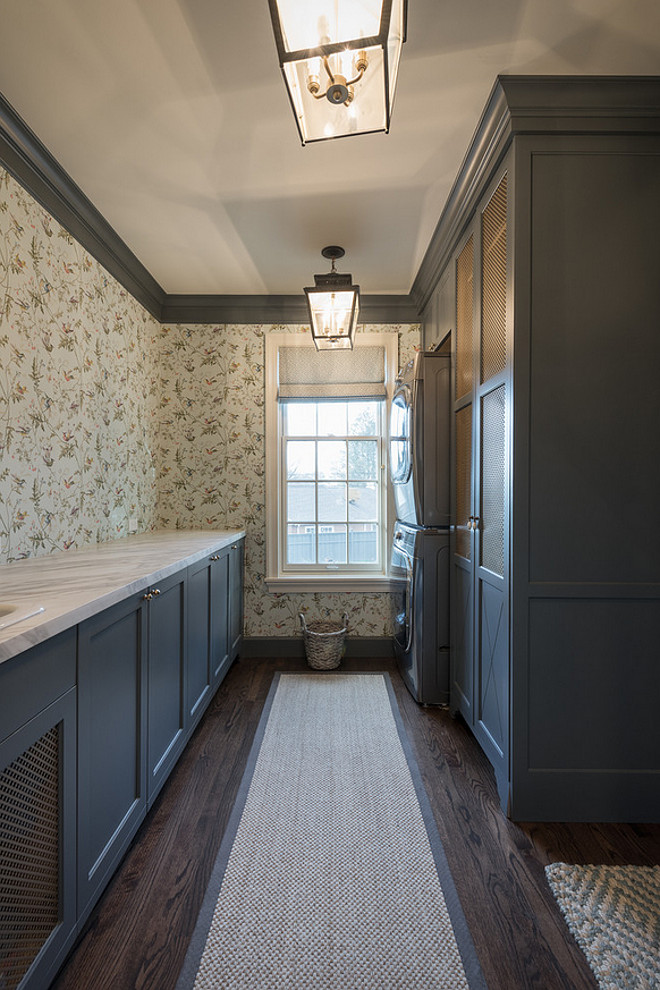 Laundry room with grey cabinets and trim. Laundry room with grey cabinets and dark grey trim. #Laundryroom #greycabinets Northstar Builders, Inc.