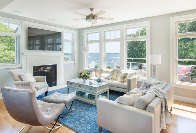 Living room. I love how casual and airy this living room feels. Fireplace stone is White Haze Marble, Honed. #livingroom #windows #WhiteHazeMarble #fireplace Caldwell & Johnson Custom Builders & Remodelers