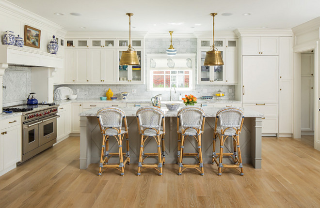 Off white kitchen with gray island and white oak hardwood floors. Beautiful Off white kitchen with gray island and white oak hardwood floors. #Offwhitekitchen #grayisland #whiteoak #hardwoodfloors