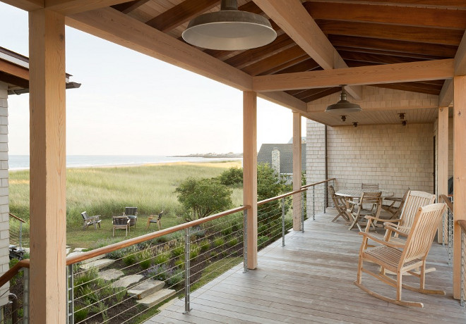 Open porch - brigde style porch connecting main house with guest house. Brigde style porch features cable railing. #porch #railing #cablerailing #homes #brigde Bowley Builders