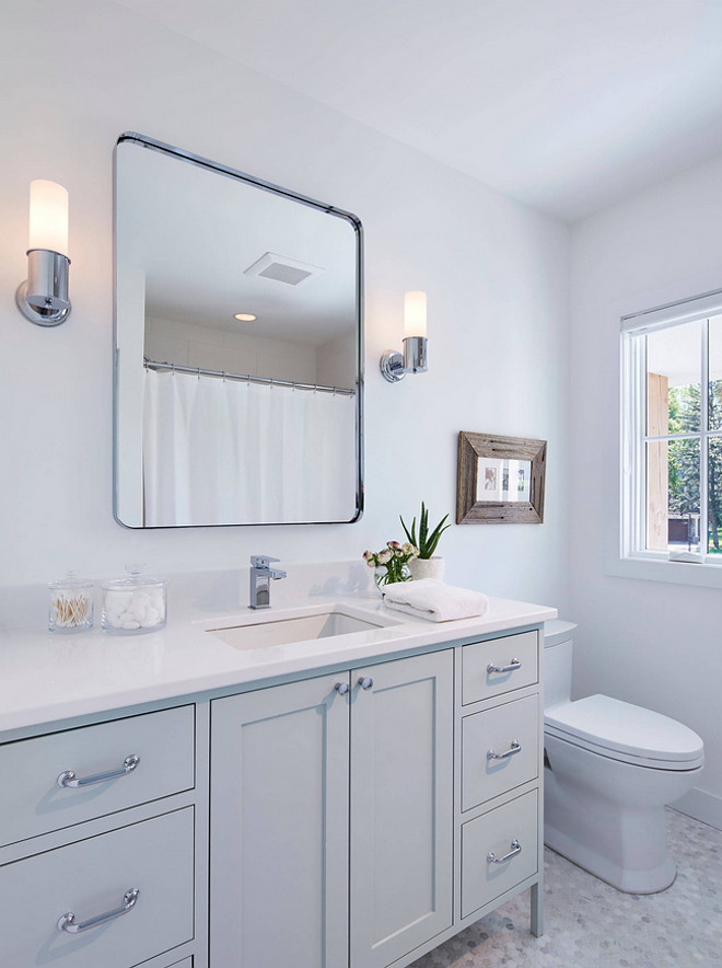 Pale grey cabinet with Calcutta Marble, 1” Circle, Polished floor tile. Bathroom floor tile is Calcutta Marble, 1” Circle, Polished - one of my favorites! The paint color on this vanity was done with Benjamin Moore Gray Cashmere 2138-60 with a high gloss finish. #Palegrey #cabinet #floor #tile #CalcuttaMarbleCircletile #Polishedmarble #marbletile Martha O'Hara Interiors