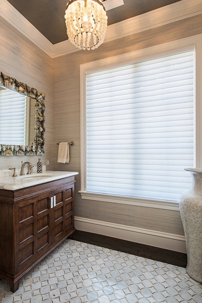 Powder Room Flooring. Chic Powder Room features marble mosaic flooring and wood. #PowderRoom #MosaicFlooring #Flooring BCB Homes, Inc.