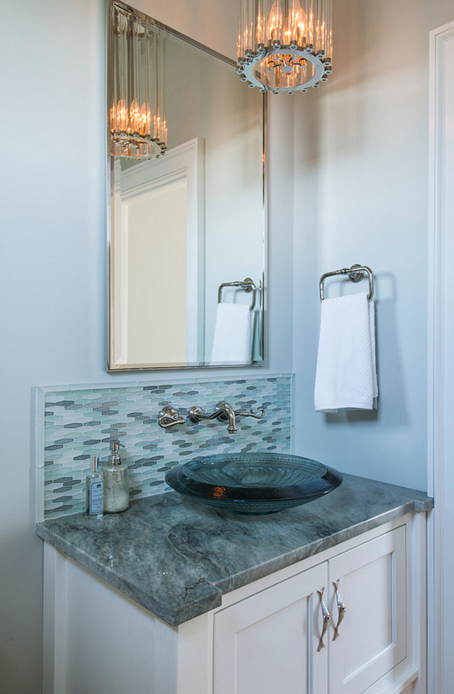 Powder room countertop and backsplash tile. The Countertop is a very dark piece of Sea Pearl Quartzite and the tile is Lunada Bay Mizumi Martini Blend Ice Crystal. #Powderoom #Countertop #Backsplash Caldwell & Johnson Custom Builders & Remodelers