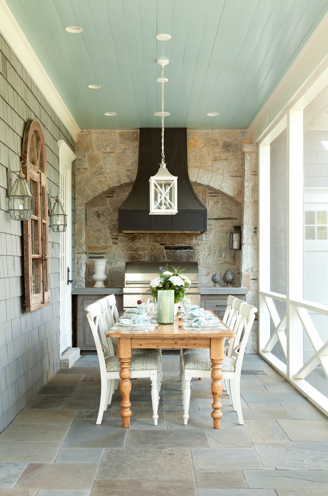 Screened in outdoor kitchen with bluestone floor tiles and blue painted ceiling. Ceiling paint color is Benjamin Moore Silver Mist. Paint color is Benjamin Moore Silver Mist. #outdoors #kitchen #blueceiling #paintcolor #BenjaminMooreSilverMist Paint color is Benjamin Moore Silver Mist T.S. Adams Studio. Interiors by Mary McWilliams from Mary Mac & Co.