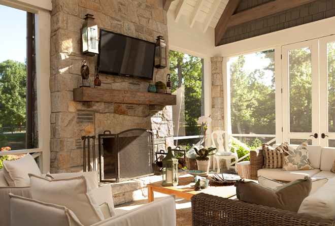 Screened in porch with fireplace. The screened-in porch is as comfort as any other room in the house. T.S. Adams Studio. Interiors by Mary McWilliams from Mary Mac & Co.