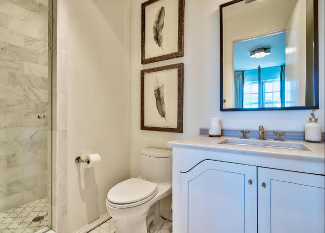 Small Guest Bathroom. This neutral small bathroom has a calm and serene feel... notice the cabinetry design. #smallbathroom #neutralbathroom Interiors by Jan Ware Designs.