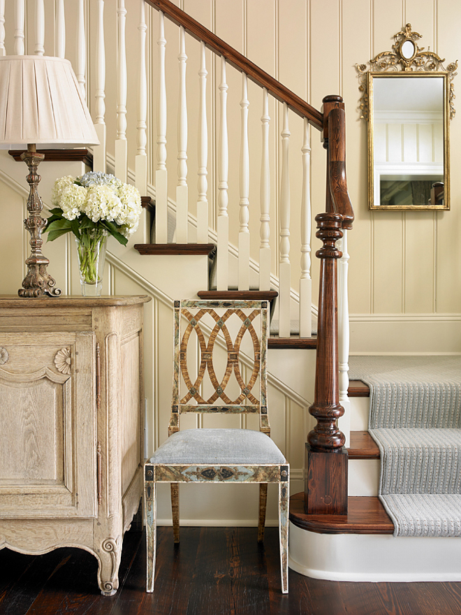 Benjamin Moore OC-8. Foyer wall paint color is Benjamin Moore OC-8 Elephant Tusk. Stairway balusters, banisters, stringers and risers are painted in Benjamin Moore OC-8 as well. #BenjaminMooreOC8