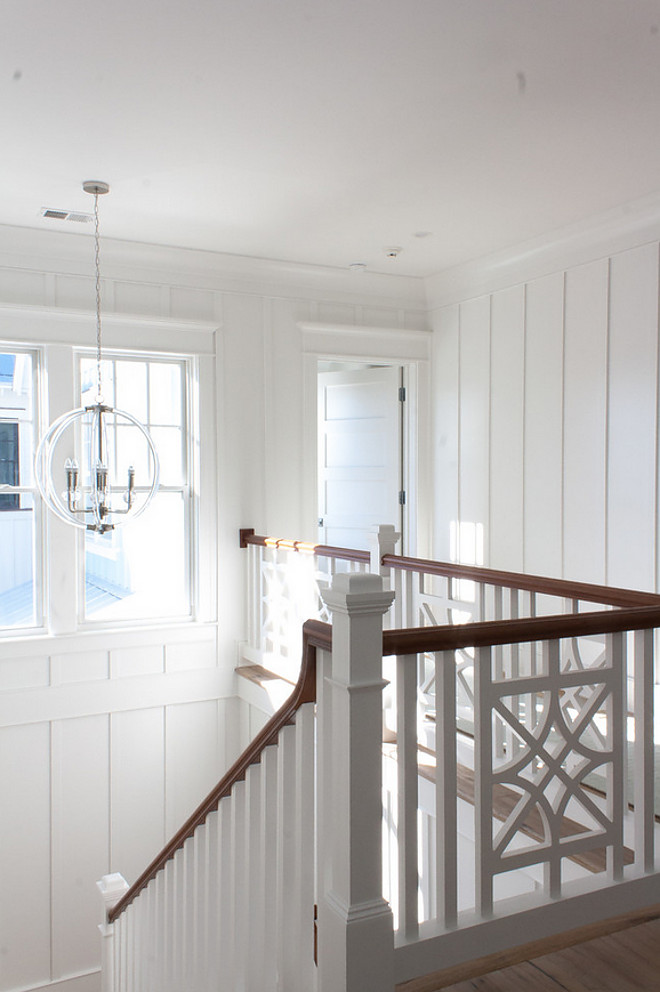 Stairwell Millwork. Upper stairwell millwork. The staircase features batten and board panels painted in Sherwin Williams Extra White. Staircase railing is custom. Trim Dimensions: 1x2 flat work every 18”. Pendant: Lucite Silver Pendant. Stairwell Millwork. Upper stairwell millwork. #LuciteSilverPendant #Stairwell #Millwork #Upperstairwell #stairwellmillwork The Guest House Studio