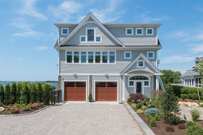 The clapboard is painted with Benjamin Moore's CW 715 Bone Black and the Trim is Sherwin Williams SW7006 Extra White. Exterior Paint color, siding and trim paint color. #exterior #paintcolor #siding #trim #BenjaminMooreBoneBlack #BenjaminMooreCW 715 #SherwinWilliamsExtraWhite7006 Caldwell & Johnson Custom Builders & Remodelers