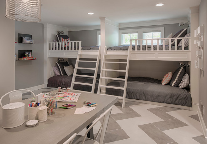 Basement bunk room and craft room area. Chevron flooring is ceramic tile. Grey wall paint color is Benjamin Moore Gray Husky 1473. Basement bunk room and craft room area. Chevron flooring is ceramic tile. #BenjaminMooreGrayHusky1473 #BenjaminMooreGrayHusky #Basement #bun room #craftroom #Chevron #flooring Studio M Interiors