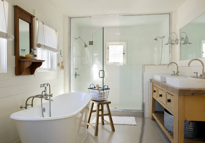 Farmhouse bathroom. Farmhouse bathroom with shiplap wainscoting, vintage farmhouse style vanity, neutral floor tile and white subway tiles in shower. #Farmhousebathroom #Farmhouse #bathroom #shiplap #wainscoting #vintage #farmhousestyle ZeroEnergy Design