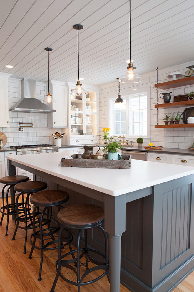 Farmhouse kitchen with shiplap plank ceiling and beadboard island painted in a dark grey. Farmhouse kitchen island paint color is Storm Gray in Dura Supreme. #Farmhousekitchen #kitchen #farmhousestyle #farmhousekitchen Advance Design Studio, Ltd.