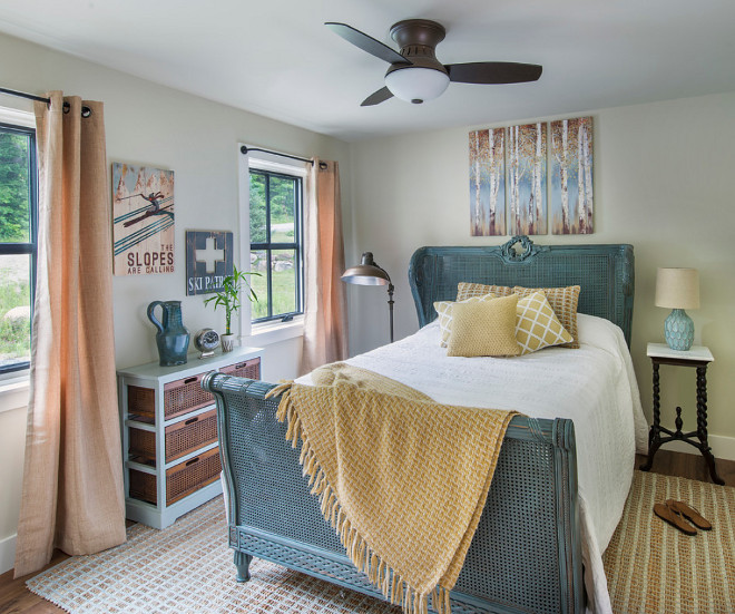 Cottage bedroom with Blue French Cane Bed. I fell in love with this bed and had to ask more details about to the designer, Tina Caldwell. Here's what Tina had to say about this antique cane bed: "The bed was purchased at resale shop and it was the color of vanilla ice cream. I put a layer of Modern Masters Bronze on, and went over it with Benjamin Moore Knoxville Gray". . #Bluebed #FrenchCaneBed #CaneBed #BenjaminMooreKnoxvilleGray #DIY #PaintingFurniture Caldwell & Johnson Custom Builders & Remodelers