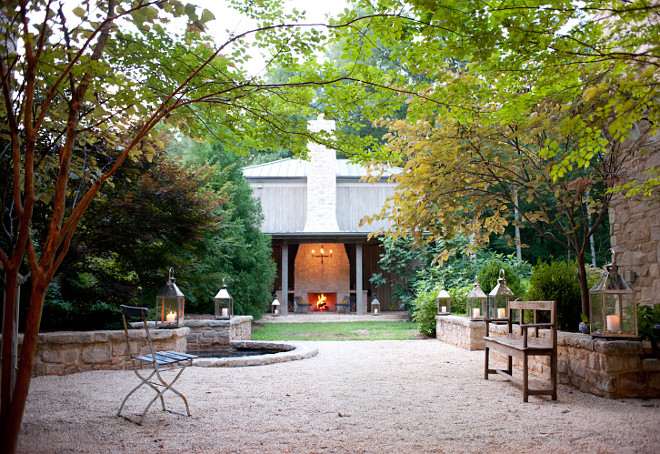 Gravel Backyard. French style Gravel Backyard with stone walls. #Stonewalls Smith Hanes