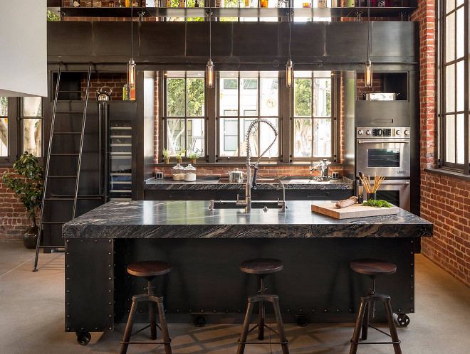 Industrial kitchen countertop and steel cabinets. Industrial Kitchen Steel Cabinets: According to the designer, the homeowner didn’t want solid metal cabinets that would create a clanging racket every time he dropped a piece of silverware into a drawer or shut a cabinet. So Bayon’s firm designed and built wood cabinets, then had another company, Berlin, fabricate steel panels to cover everything. The countertops are Silver Brown Wave marble. #Industrialkitchen #steelcabinet #steelcabinets #countertop #SilverBrownWave #marble Muratore Construction + Design