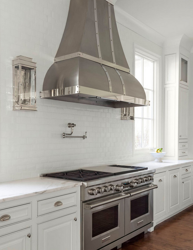 Kitchen sconces. Kitchen sconces on both sides of kitchen hood. Kitchen sconces. Kitchen sconces on both sides of kitchen hood. #Kitchensconces #Kitchen #sconces #hood Robert Elliott Custom Homes