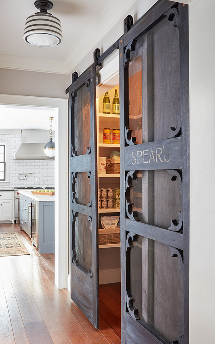 Pantry doors. Pantry antique door hung with barn door hardware. Antique doors look even better if installed as sliding #barndoors. These add a #rustic charm to this #farmhousekitchen and #pantry. Kristina Crestin Design