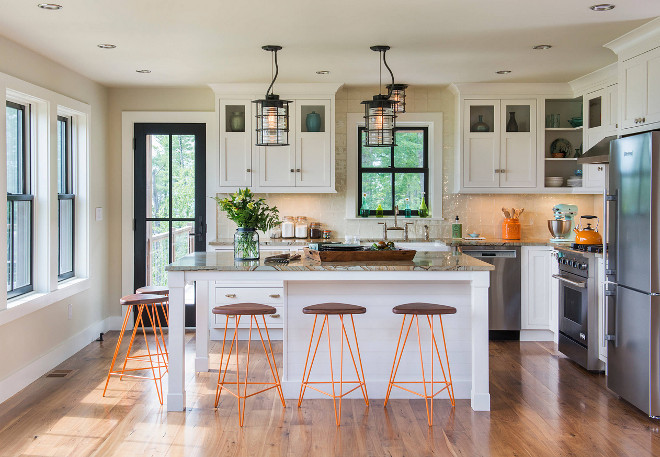 Modern Farmhouse Ivory white kitchen. Modern Farmhouse Ivory white kitchen with wide plank floors, black frame windows and neutral wall paint color. The kitchen inset cabinets are from Starmark in Marshmallow Cream. Modern Farmhouse Ivory white kitchen #ModernFarmhouse #Ivorywhite #kitchen #ModernFarmhouse #Ivorywhite #kitchen #farmhousekitcheninsetcabinet #insetcabinet Caldwell & Johnson Custom Builders & Remodelers